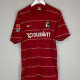 2009/10 FREIBURG GLOCKNER #19 *SQUAD SIGNED* HOME SHIRT (L) NIKE