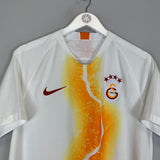 2018/19 Galatasaray third shirt by Nike in excellent condition, size medium, featuring unique orange design and team logo.