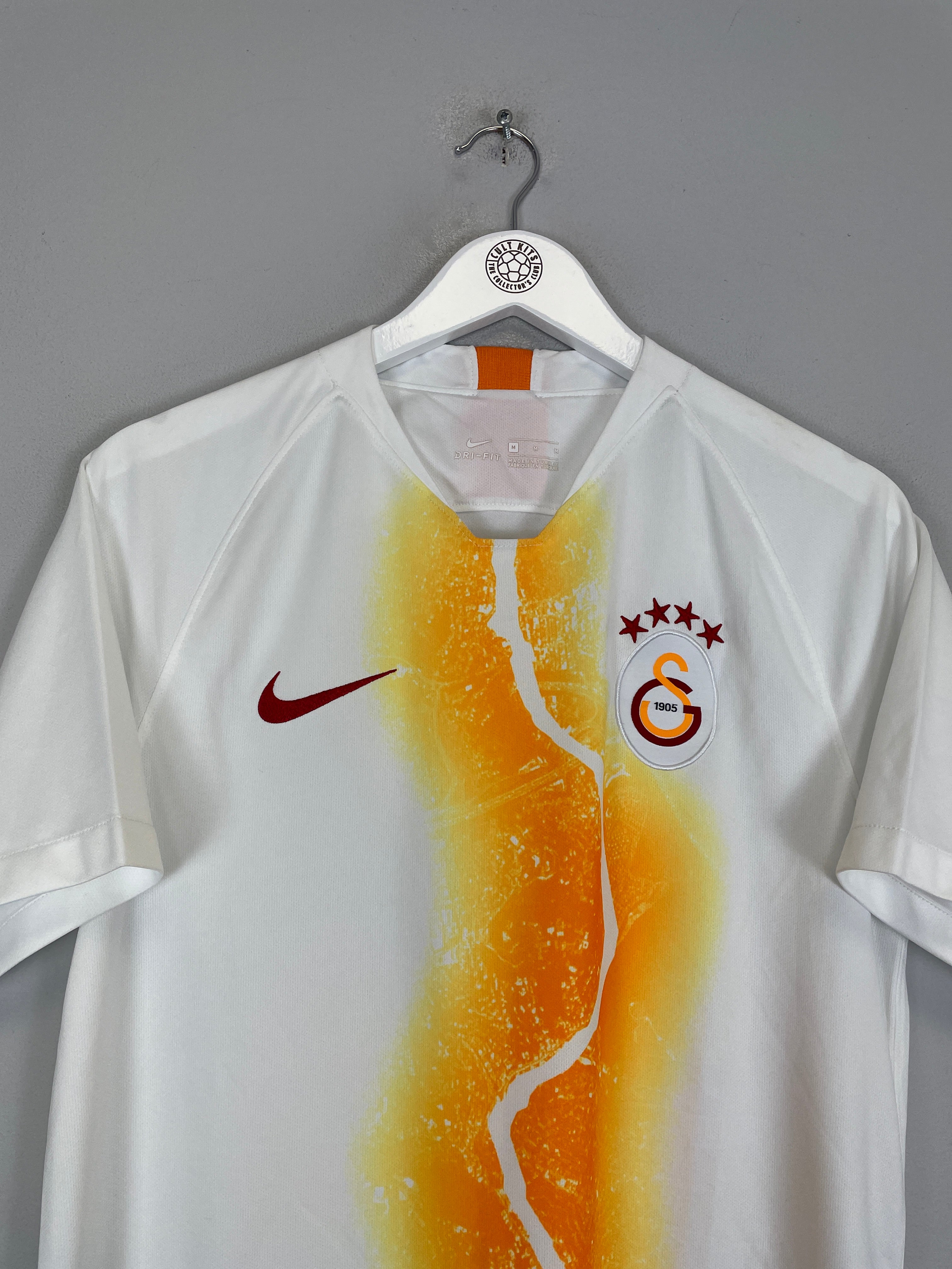 2018/19 Galatasaray third shirt by Nike in excellent condition, size medium, featuring unique orange design and team logo.