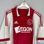 2011/12 Ajax home shirt by Adidas, size large, in excellent condition, featuring red and white design with Aegon logo.