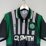 1994/95 Celtic away shirt by Umbro in excellent condition, size medium, featuring team logo and unique design.