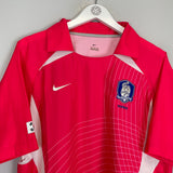 2002/04 South Korea home shirt size L by Nike in excellent condition, vibrant pink with logo and mesh design.