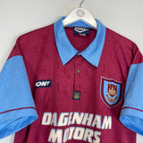 1995/97 West Ham home shirt in excellent condition, size large, manufactured by Pony, featuring Dagenham Motors logo.