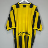 Borussia Dortmund 2000/02 home shirt in yellow and black, size XL, showing the back design with 'DORTMUND' printed.