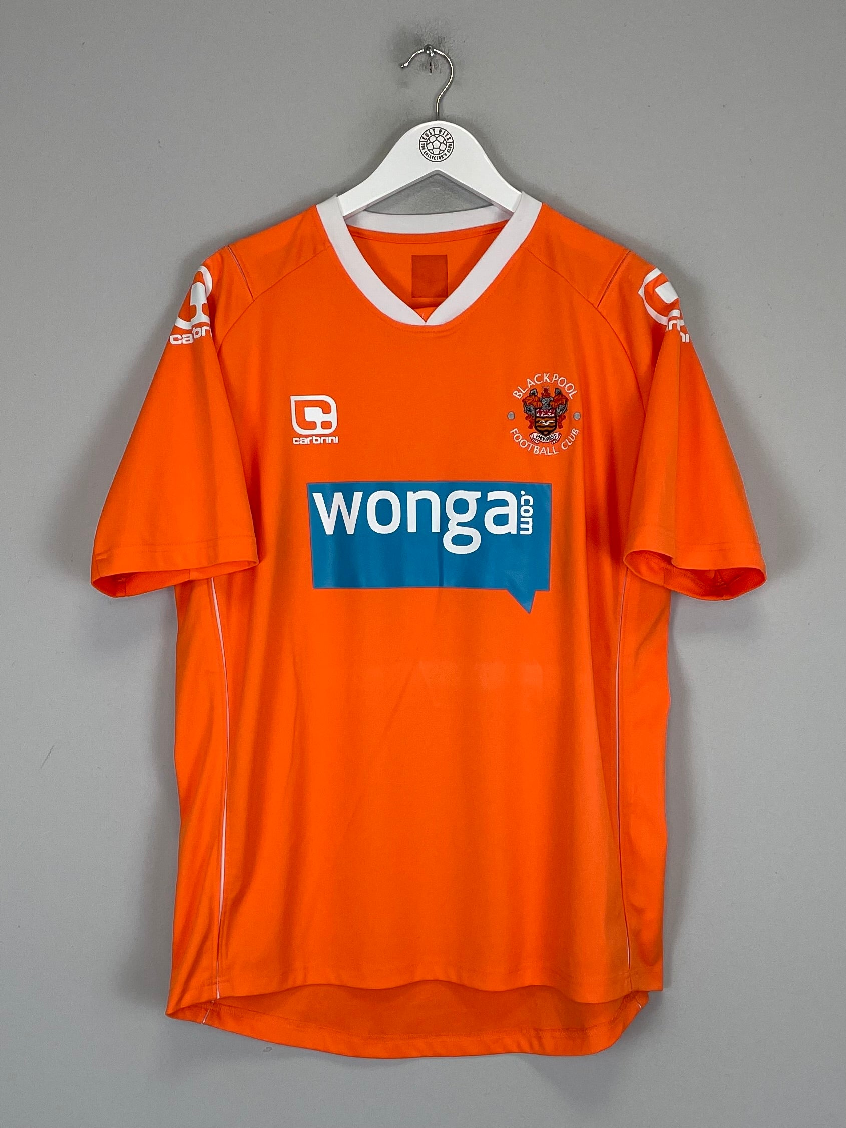 2010/11 Blackpool home shirt, orange, size M, Carbrini, featuring Wonga sponsorship, excellent condition, product code BLAC42109.