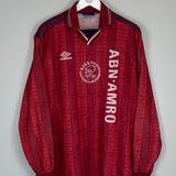 1994 Ajax training shirt in red, size XL, by Umbro, featuring ABN AMRO logo and unique pattern, in excellent condition.