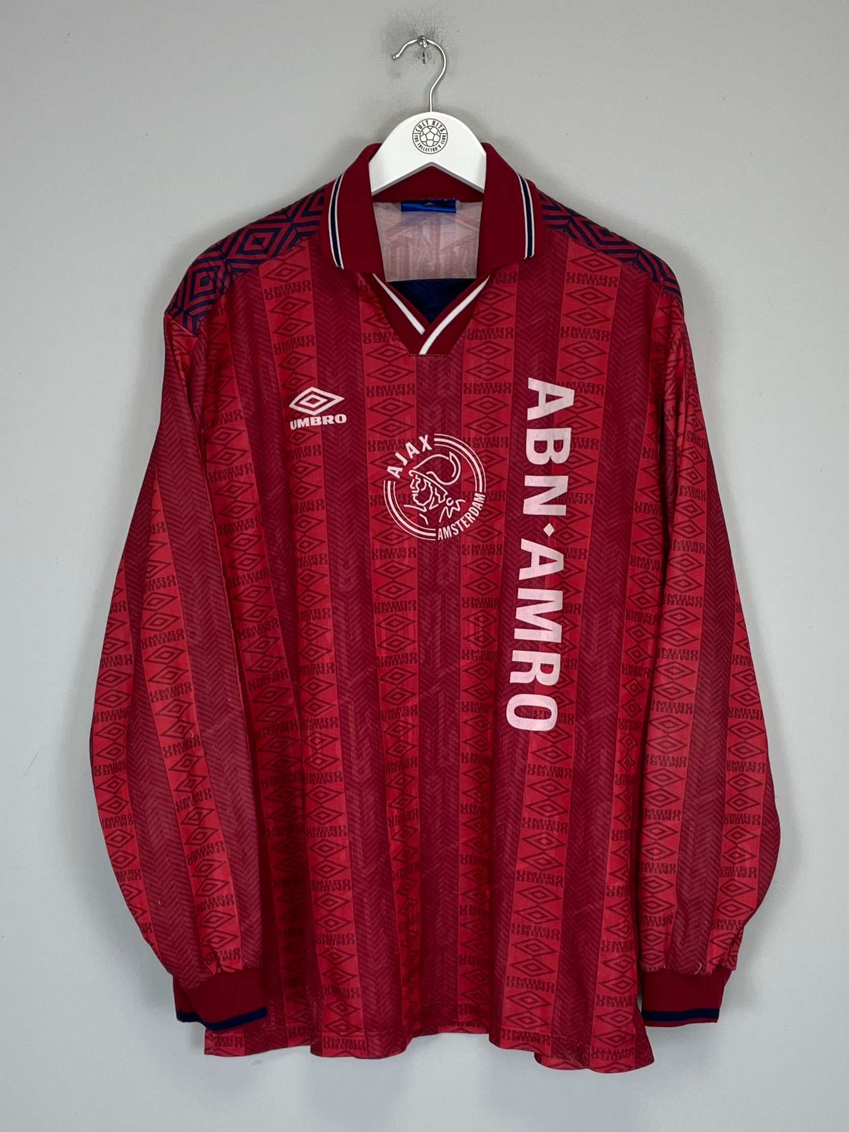 1994 Ajax training shirt in red, size XL, by Umbro, featuring ABN AMRO logo and unique pattern, in excellent condition.