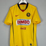 2008/09 Club America home shirt by Nike, medium size, yellow with Bimbo logo, in good condition with minor marks.