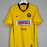 2008/09 Club America home shirt by Nike, medium size, yellow with Bimbo logo, in good condition with minor marks.