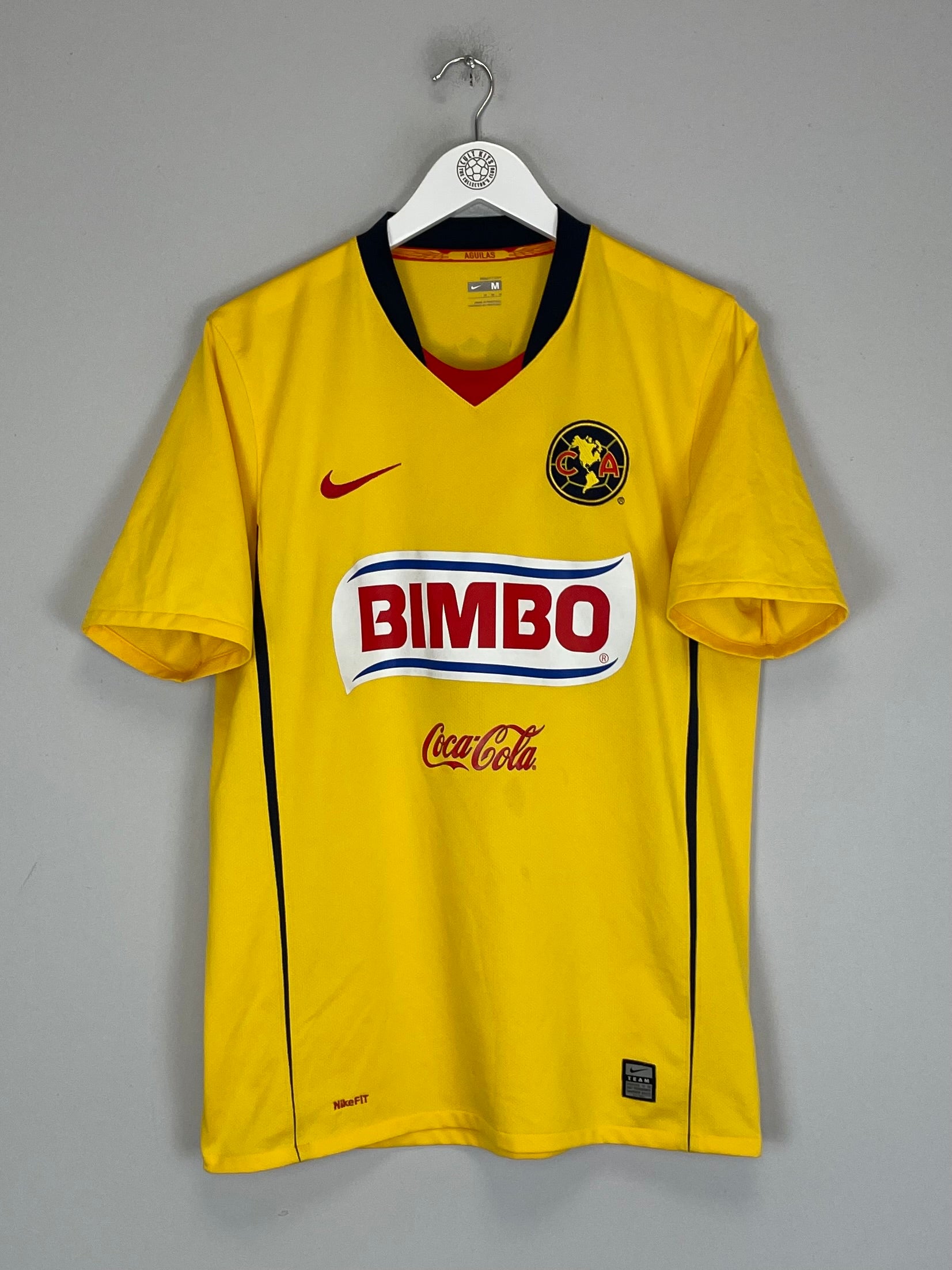 2008/09 Club America home shirt by Nike, medium size, yellow with Bimbo logo, in good condition with minor marks.