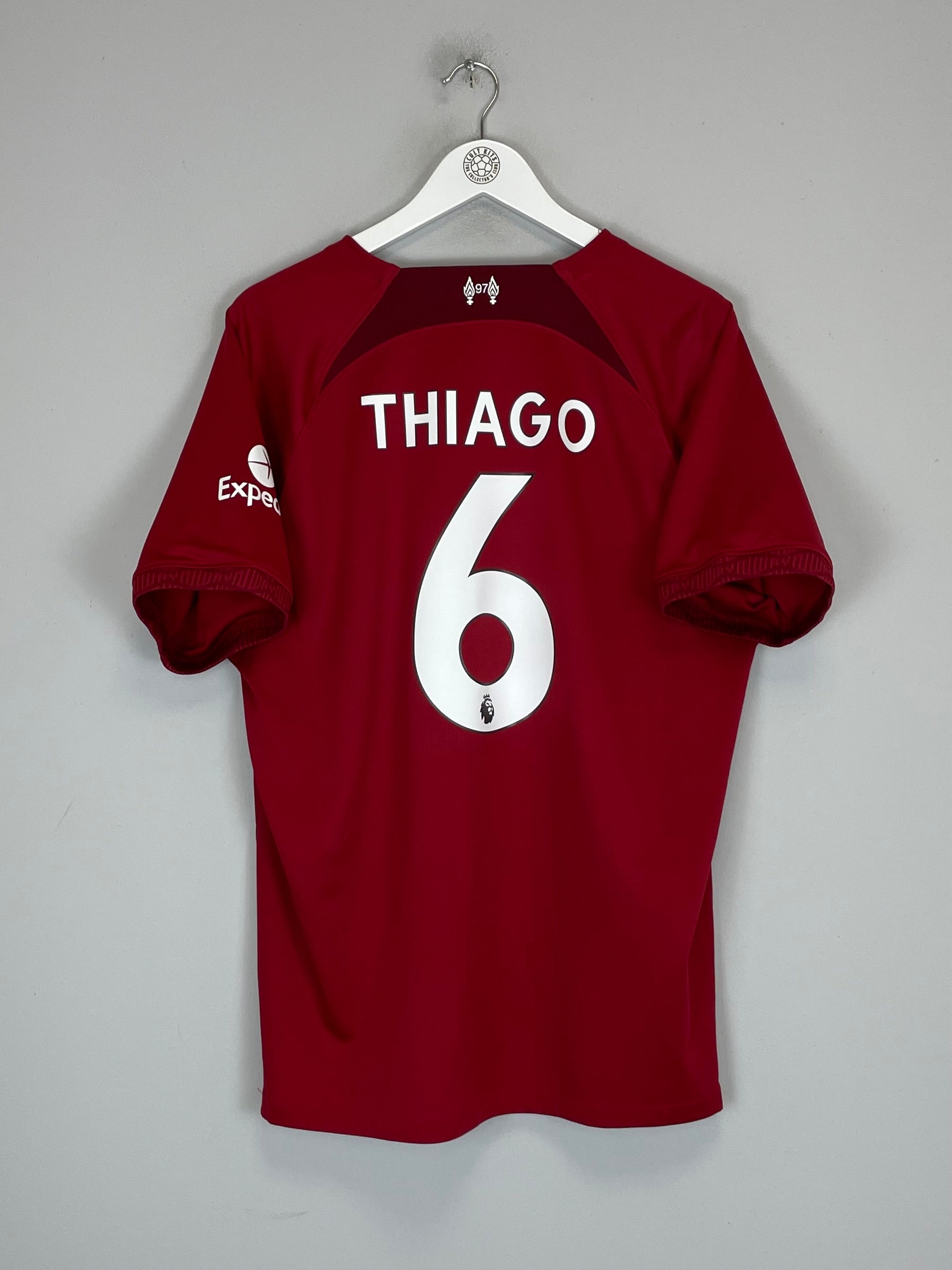 2022/23 Liverpool Thiago #6 home shirt in red, size XL, manufactured by Nike, displayed on a hanger.