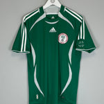 2006/07 Nigeria home shirt by Adidas in green, size small, excellent condition, featuring team logo and Adidas branding.