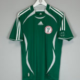 2006/07 Nigeria home shirt by Adidas in green, size small, excellent condition, featuring team logo and Adidas branding.