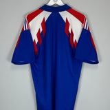 Back view of the 1990/92 France home shirt (L) by Adidas, featuring red and white stripes on blue fabric. Excellent condition.